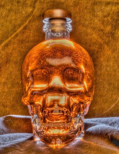 A photo of an empty bottle of skull vodka